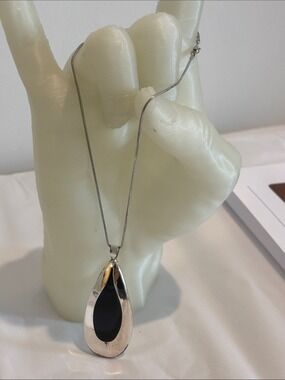 Silver tear drop necklace black inset 16” chain NSD marking on back 1.3oz